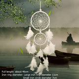 White dreamcatcher with feathers