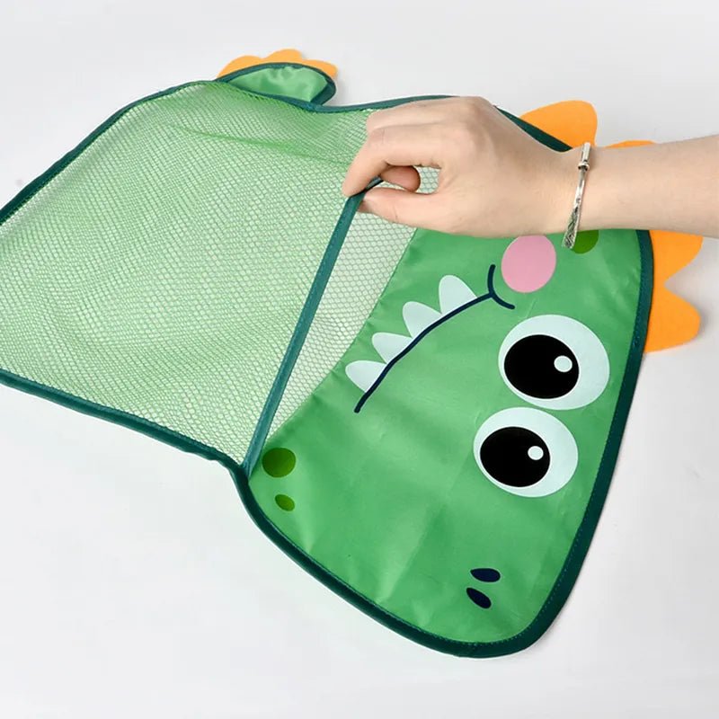 Green dinosaur-shaped sunshade with a hand pulling on the mesh.