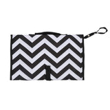 Black and white chevron patterned bag with a strap on a white background
