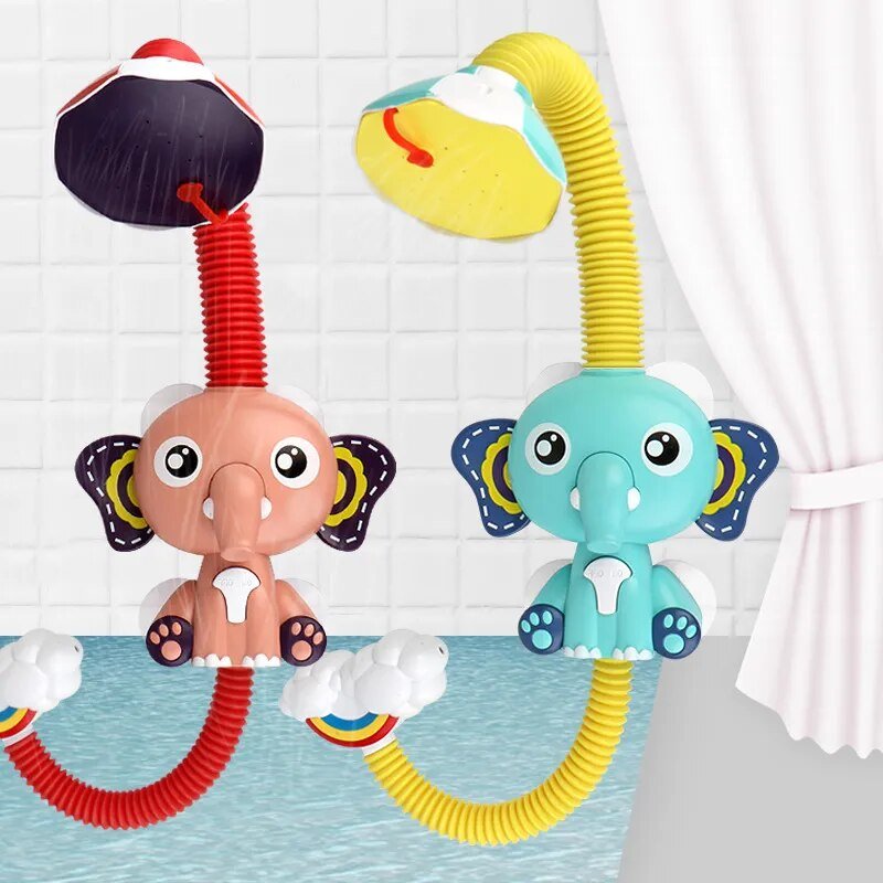 Two colorful elephant-shaped bath toys with flexible nozzles on a blue mat.