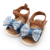 Children's sandals with blue lace bows