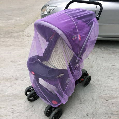 Purple baby stroller with a mesh cover in front of a car.