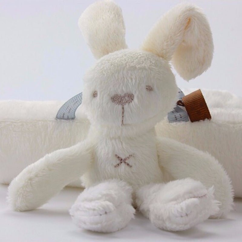 White plush bunny toy with a brown bow tie.