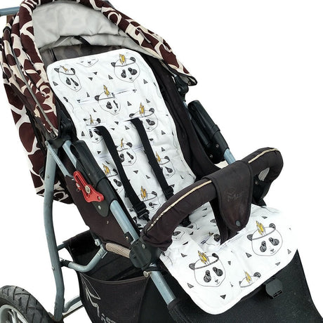Baby stroller with a patterned cover and a white seat cover