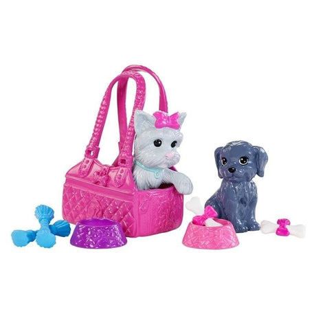 Toy cat in a pink handbag with a toy dog and accessories.