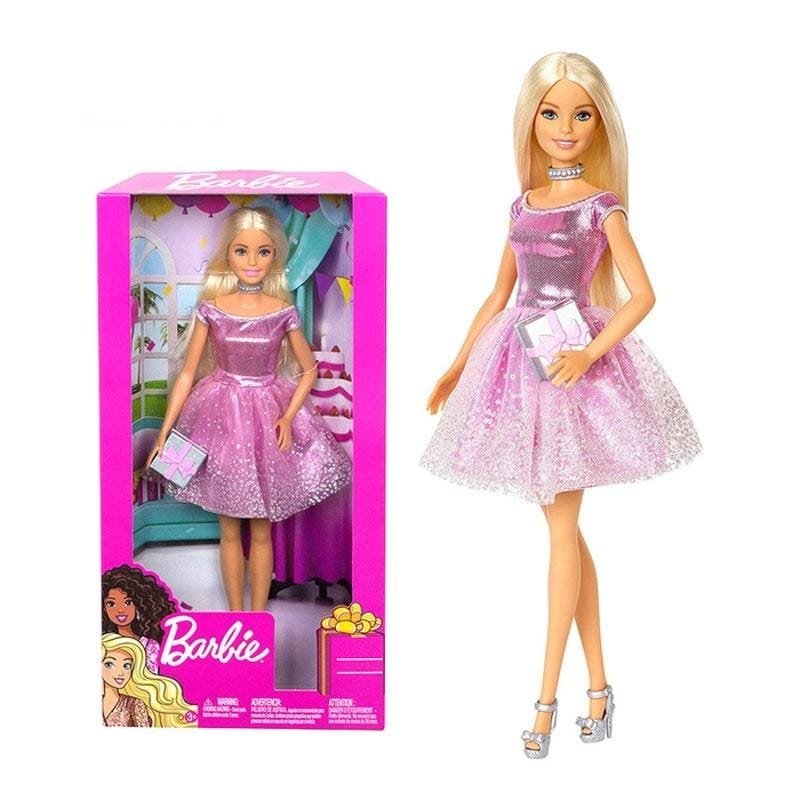Barbie doll in a pink dress with packaging 