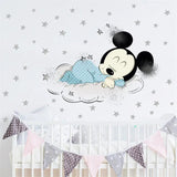 Cartoon character in a crib with star decorations on the wall