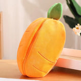 Plush toy shaped like a mango on a wooden surface.