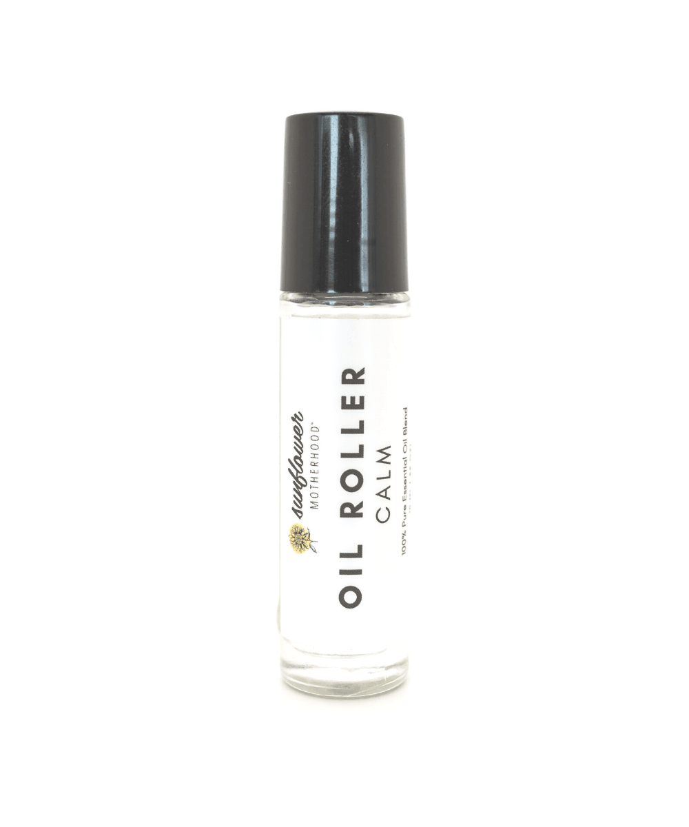Clear bottle with black cap labeled 'Oil Roller Calm'.