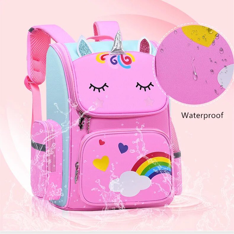 Pink unicorn backpack with rainbow and heart designs.