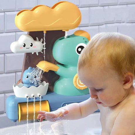 Child playing with a colorful bath toy featuring a cloud, sun, and raindrop design.