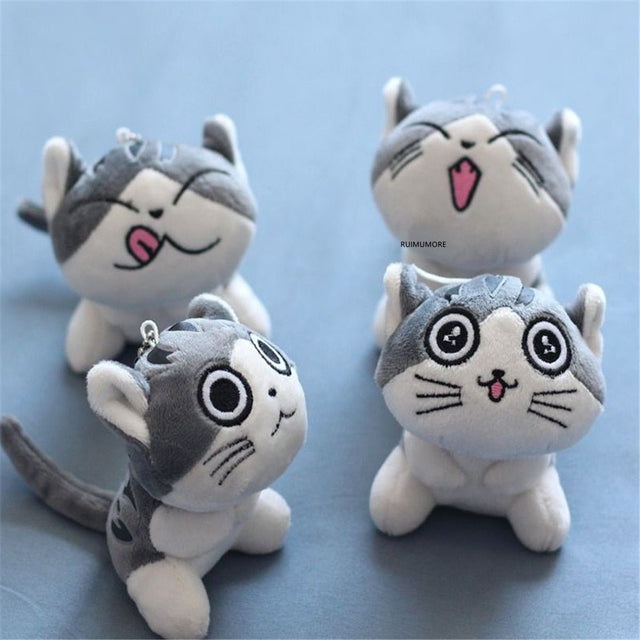 Four plush cat toys with different expressions