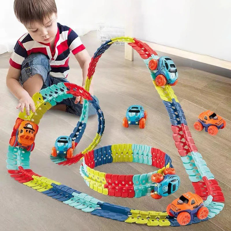 Child playing with a colorful toy track set on a wooden floor.