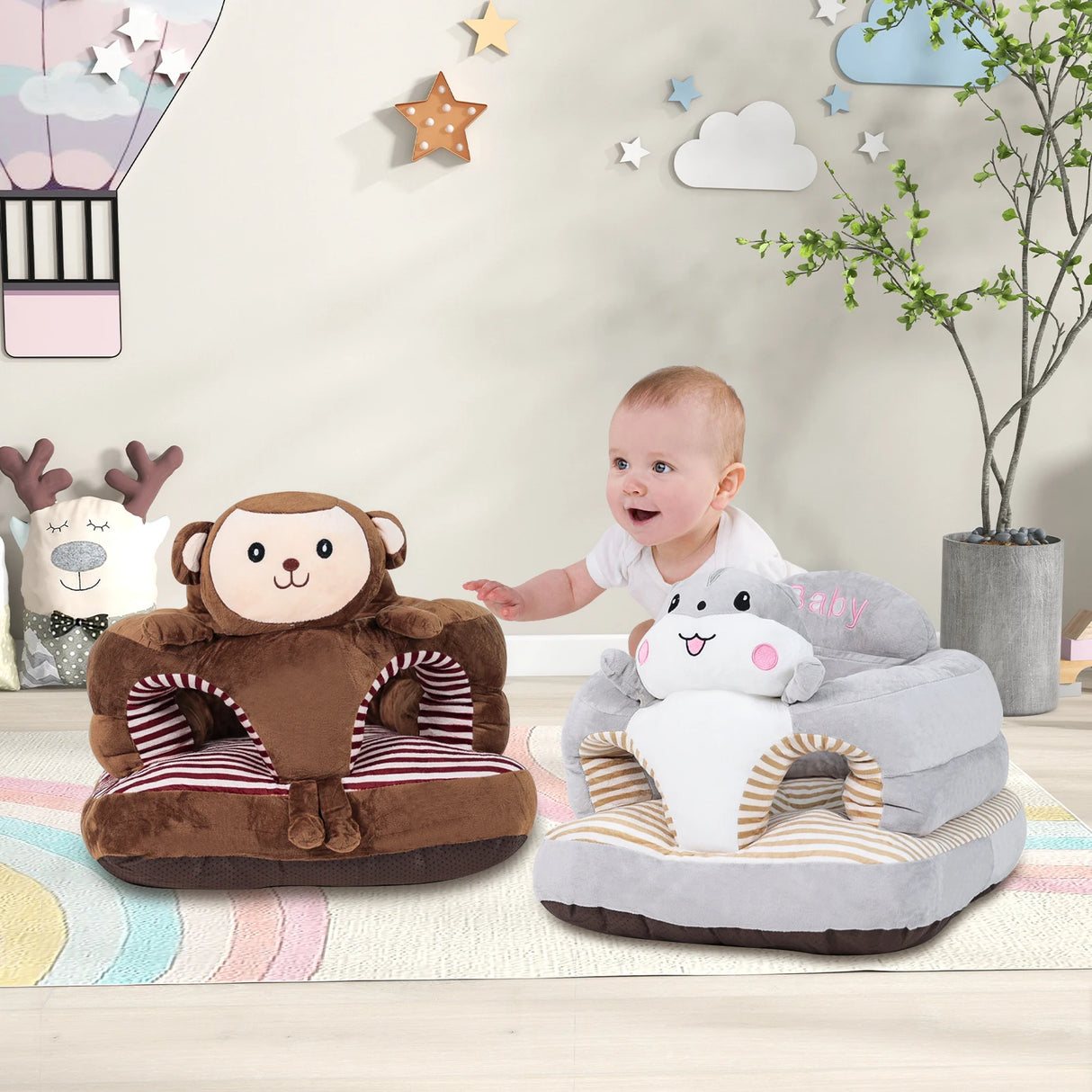 Child sitting on a gray plush chair with a cartoon shark design, next to a brown plush chair with a monkey face in a room with decorative wall stickers.