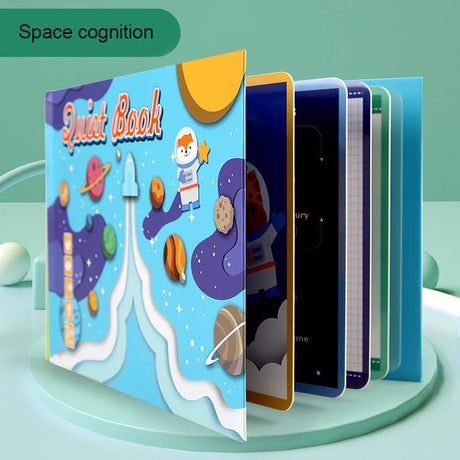 Children's quiet book with space-themed design on a green background