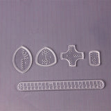 Set of clear plastic sewing templates.