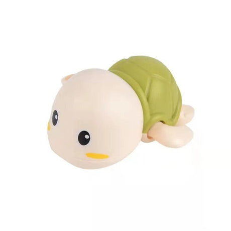 Plush toy resembling a baby in a green outfit.