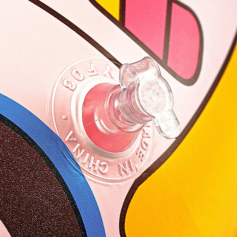 Close-up of a colorful object with a clear cap, featuring brand text.