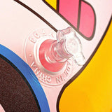 Close-up of a colorful object with a clear cap, featuring brand text.