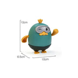 Teal toy figure with goggles and measurements.