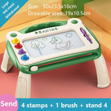 Children's drawing board with colorful stamps and a brush