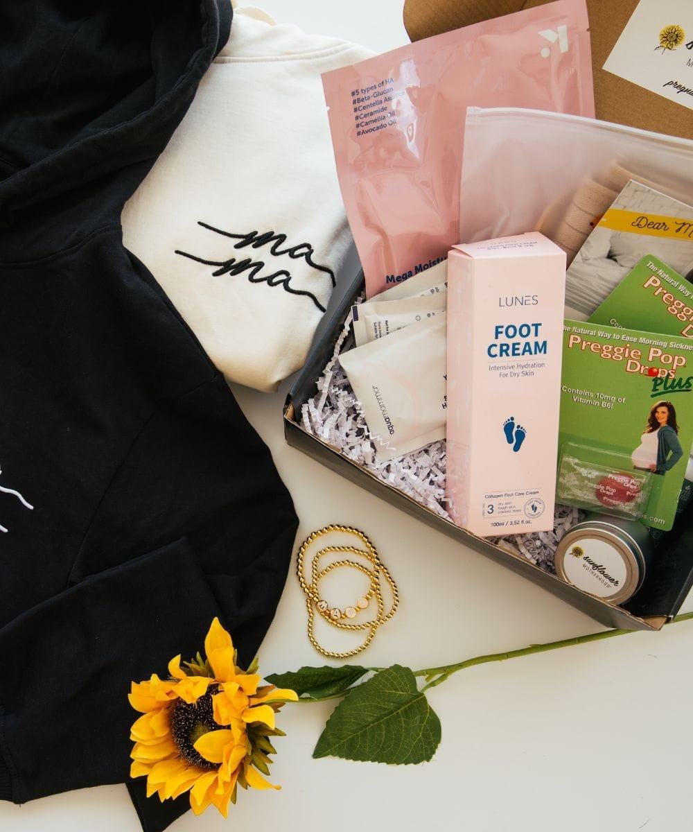 Assorted items including a sunflower, foot cream, and pregnancy care products