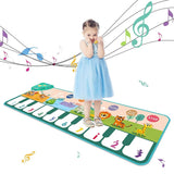 Child playing on a colorful piano mat with musical notes and animals.