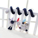 Plush toy snake with rabbit and donkey ends on a crib rail