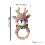 Crocheted deer rattle with dimensions and weight on a white background