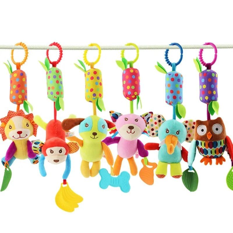Colorful baby toys with animal designs hanging on a bar.