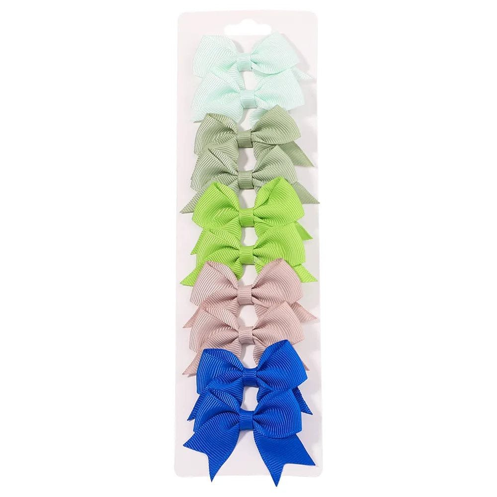 Set of colorful hair bows on a white background