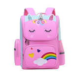 Pink unicorn backpack with rainbow and heart designs.