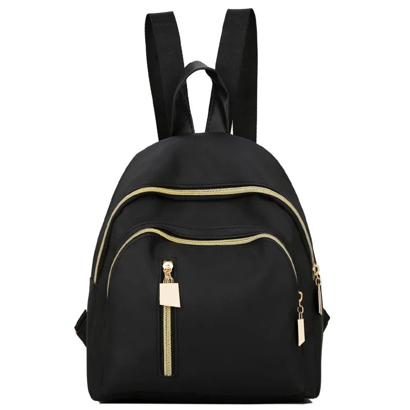 Black backpack with gold zippers.