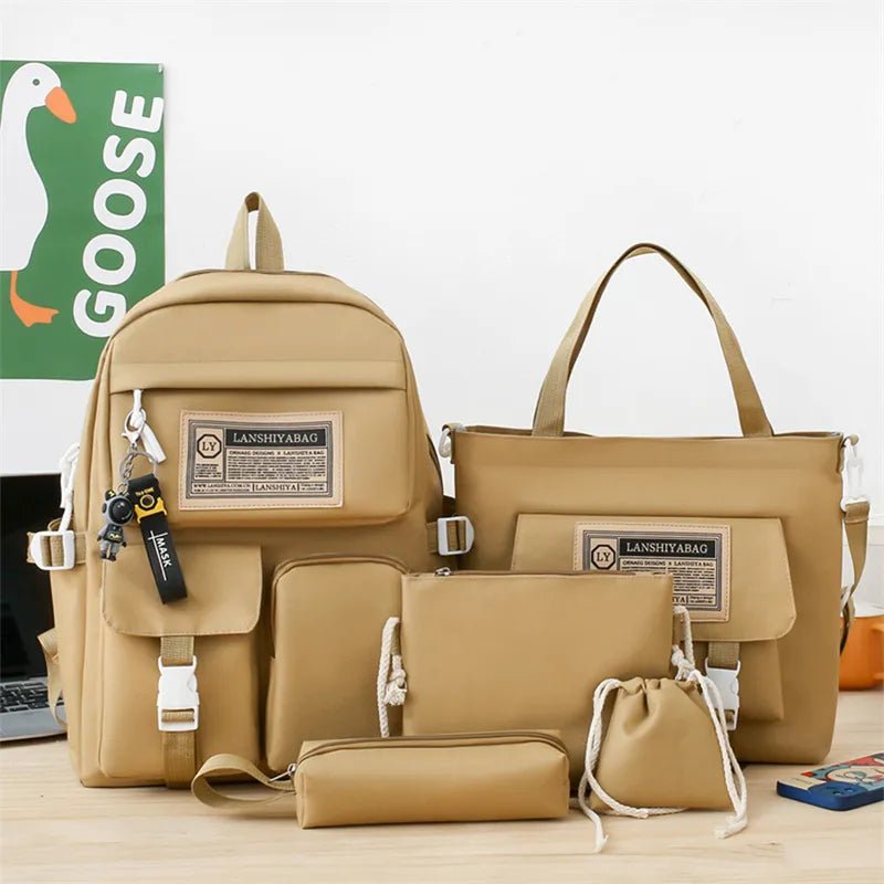 Set of beige bags including a backpack, handbag, pouch, and drawstring bag on a light surface with 'GOOSE' branding in the background.