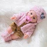 Baby doll in pink outfit with pacifier 