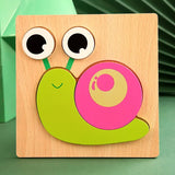 Wooden snail puzzle with googly eyes on a wooden base