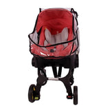 Red baby stroller with a clear plastic cover