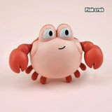 Pink crab toy with large eyes.