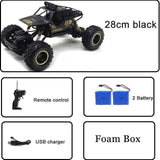 Black RC car with remote control, batteries, and USB charger