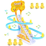 Toy track set with small ducks and musical notes.