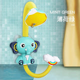 Children's shower toy shaped like an elephant with a yellow hose against a tiled bathroom wall.