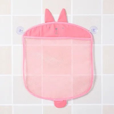 Pink mesh storage bag with bunny ears and tail attached to a tiled wall.
