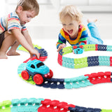 Children playing with a colorful toy train track set.