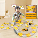 Child playing with a toy track set on a wooden floor, with a focus on track splicing and socket docking.