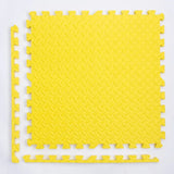Yellow interlocking foam mat on a white background