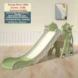 Green children's slide with additional play features on a wooden floor.