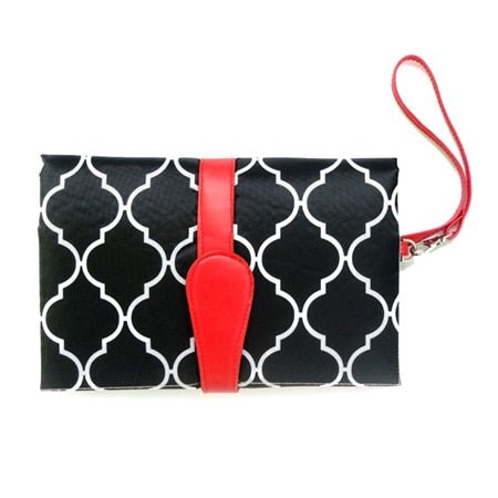 Black clutch with white pattern and red accents