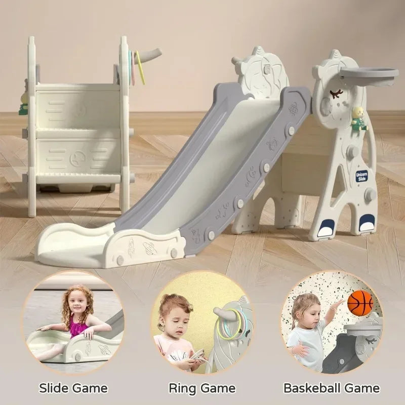 Children's playset with slide, ring, and basketball game components on a wooden floor.