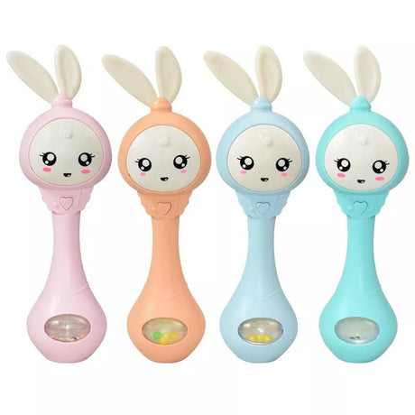 Four colorful baby rattles with bunny designs on a white background