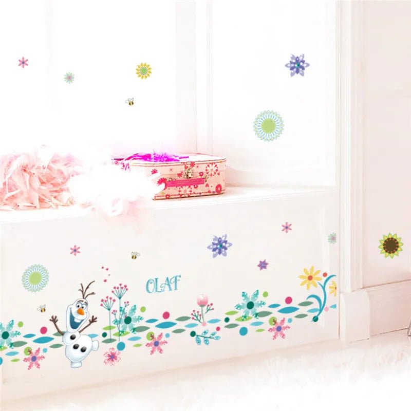 Colorful wall decals with cartoon character and flowers on a white wall.